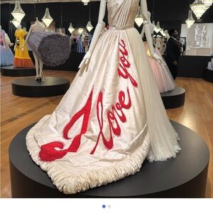 Elegant White Gown with Red Script